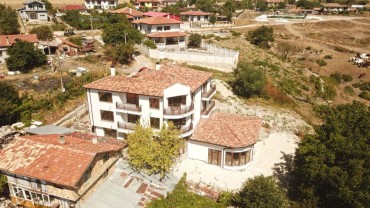Multi-family house on 4 floors in the village of Kalimantsi